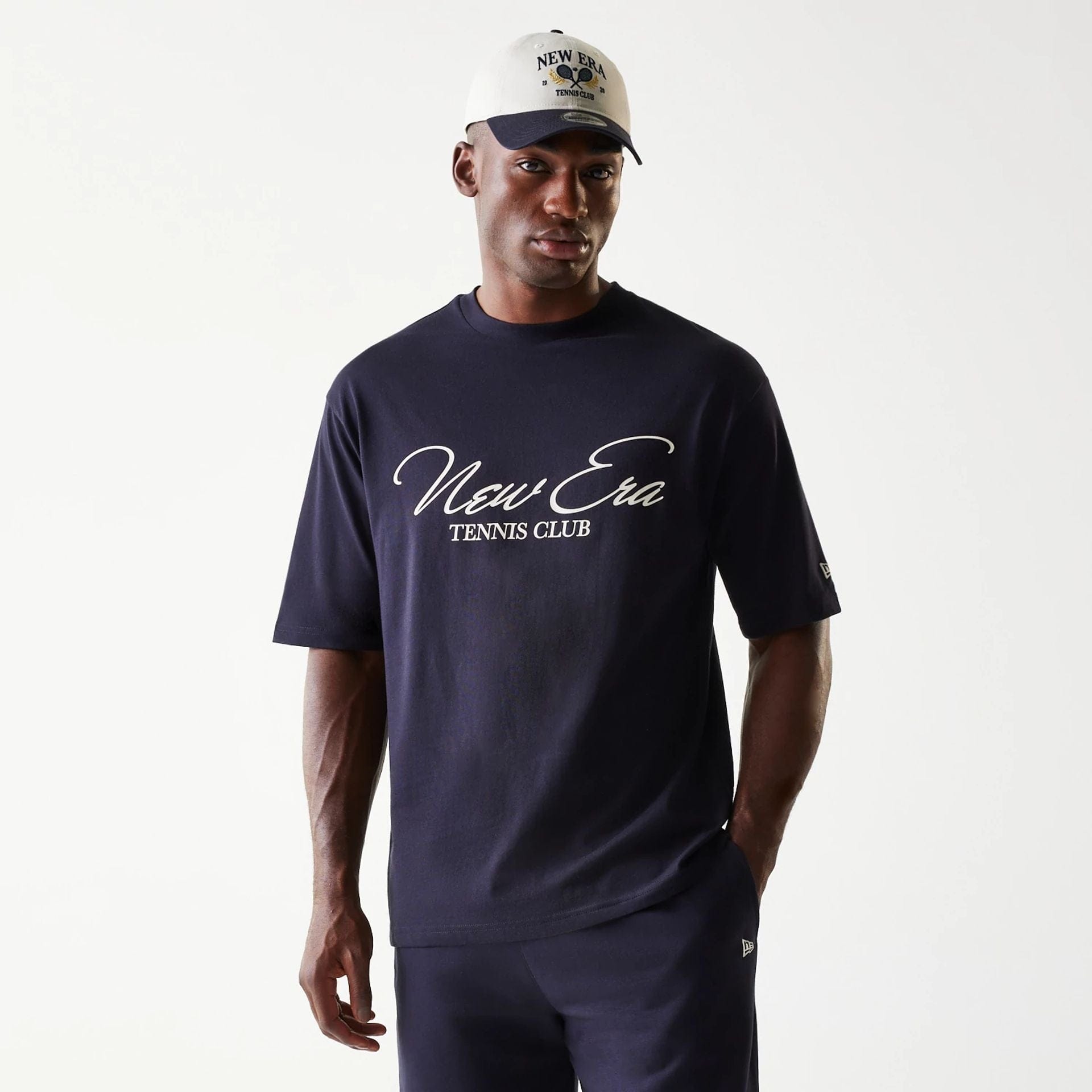 The Male model is wearing New Era Navy Oversized T-Shirt 1