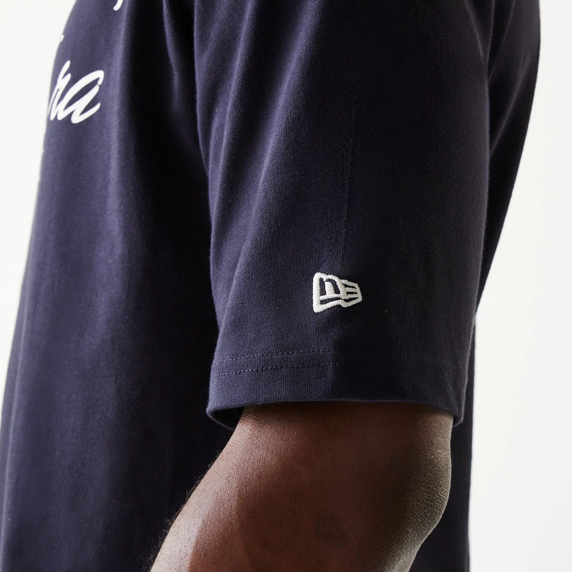 The Male model is wearing New Era Navy Oversized T-Shirt 5