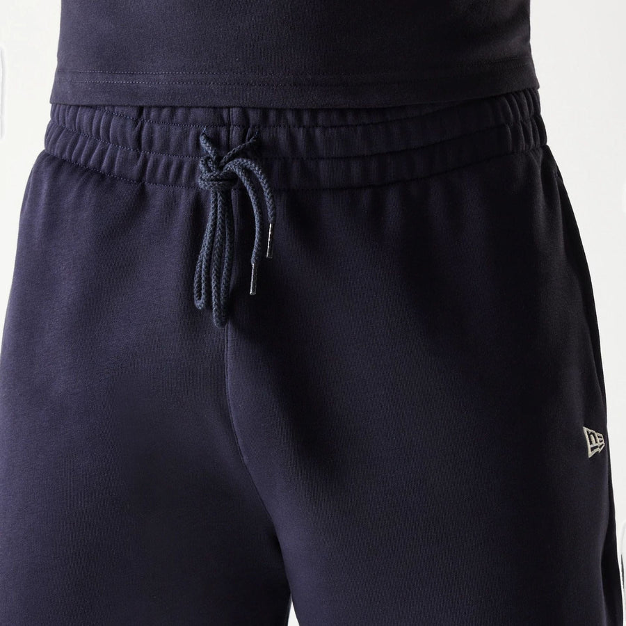 The Male model is wearing New Era Side Logo Navy Shorts 7