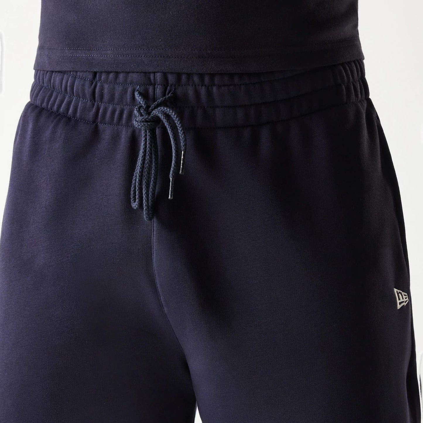 The Male model is wearing New Era Side Logo Navy Shorts 7
