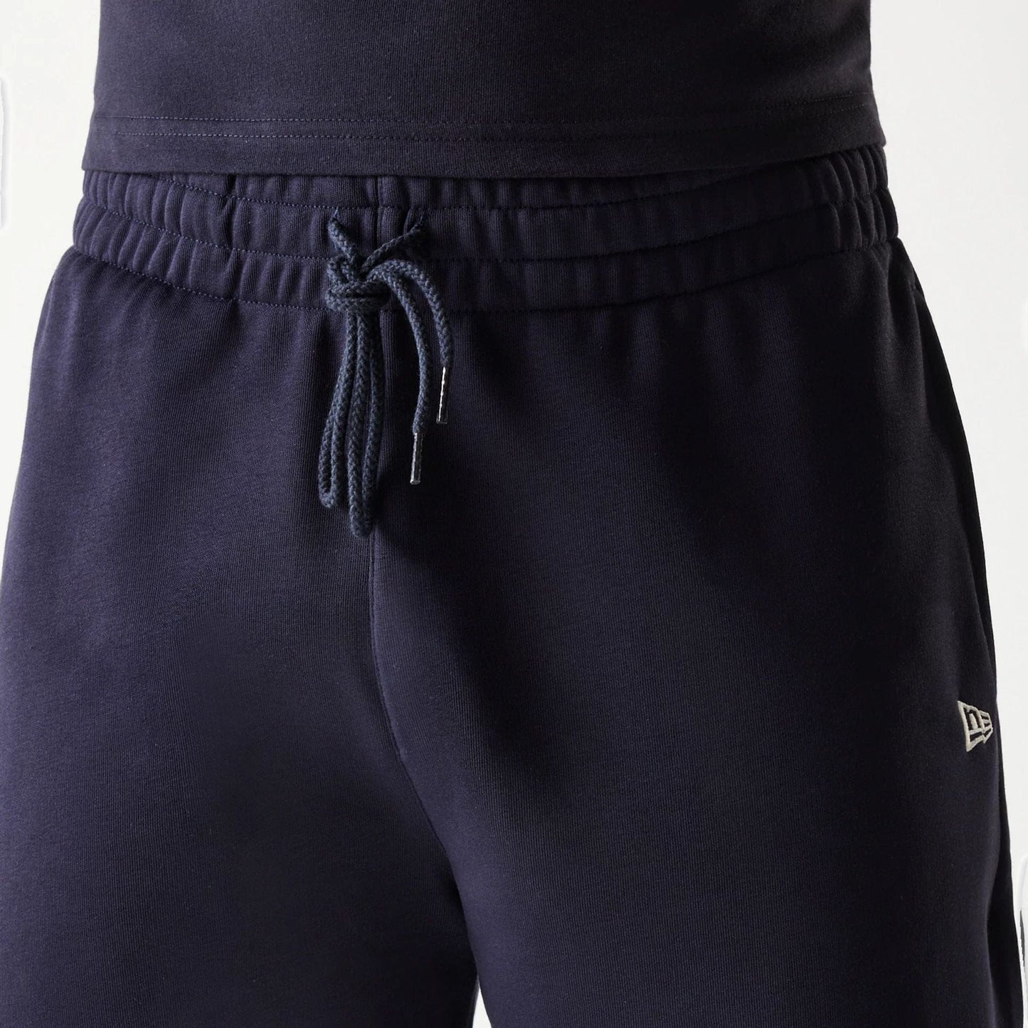 The Male model is wearing New Era Side Logo Navy Shorts 7