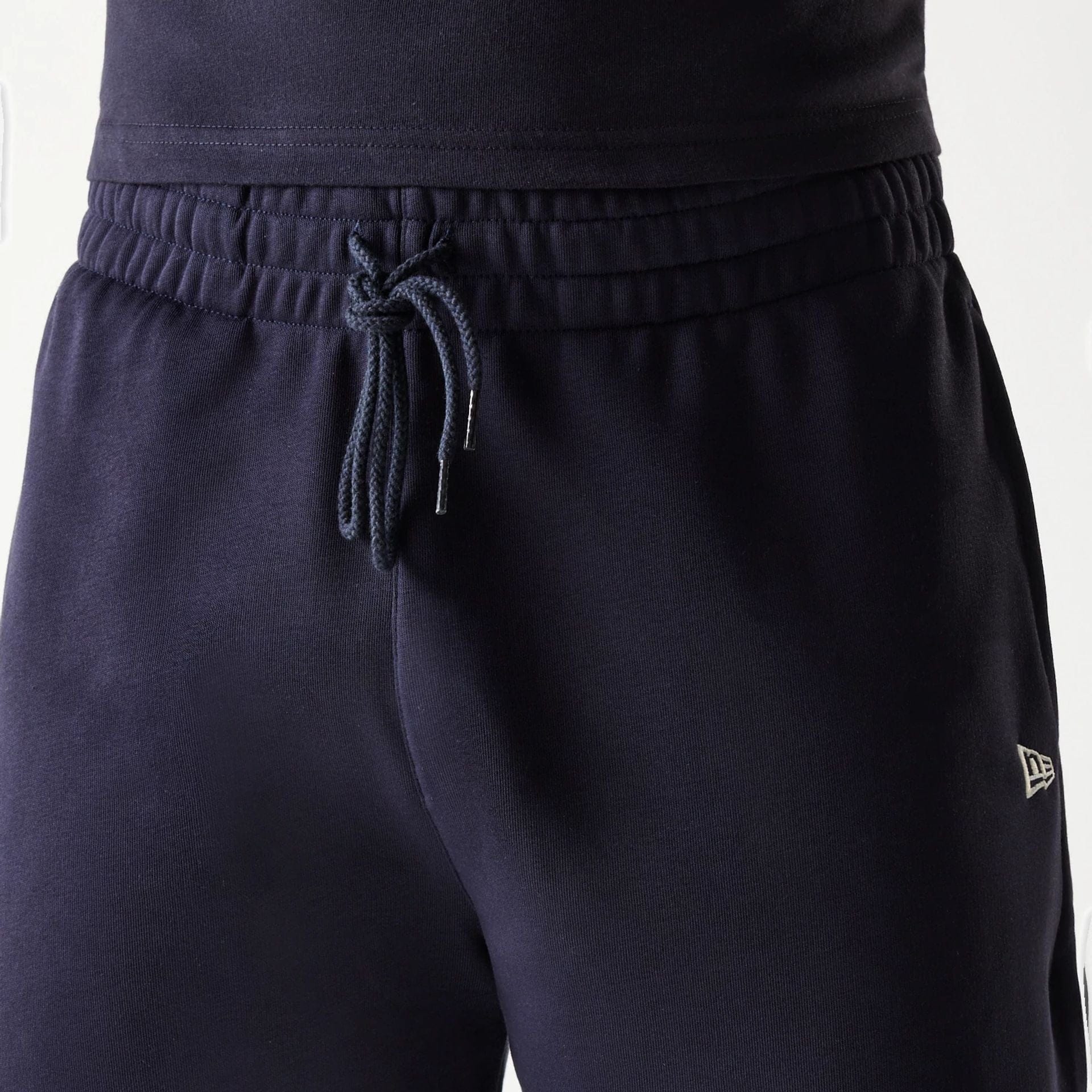 The Male model is wearing New Era Side Logo Navy Shorts 7