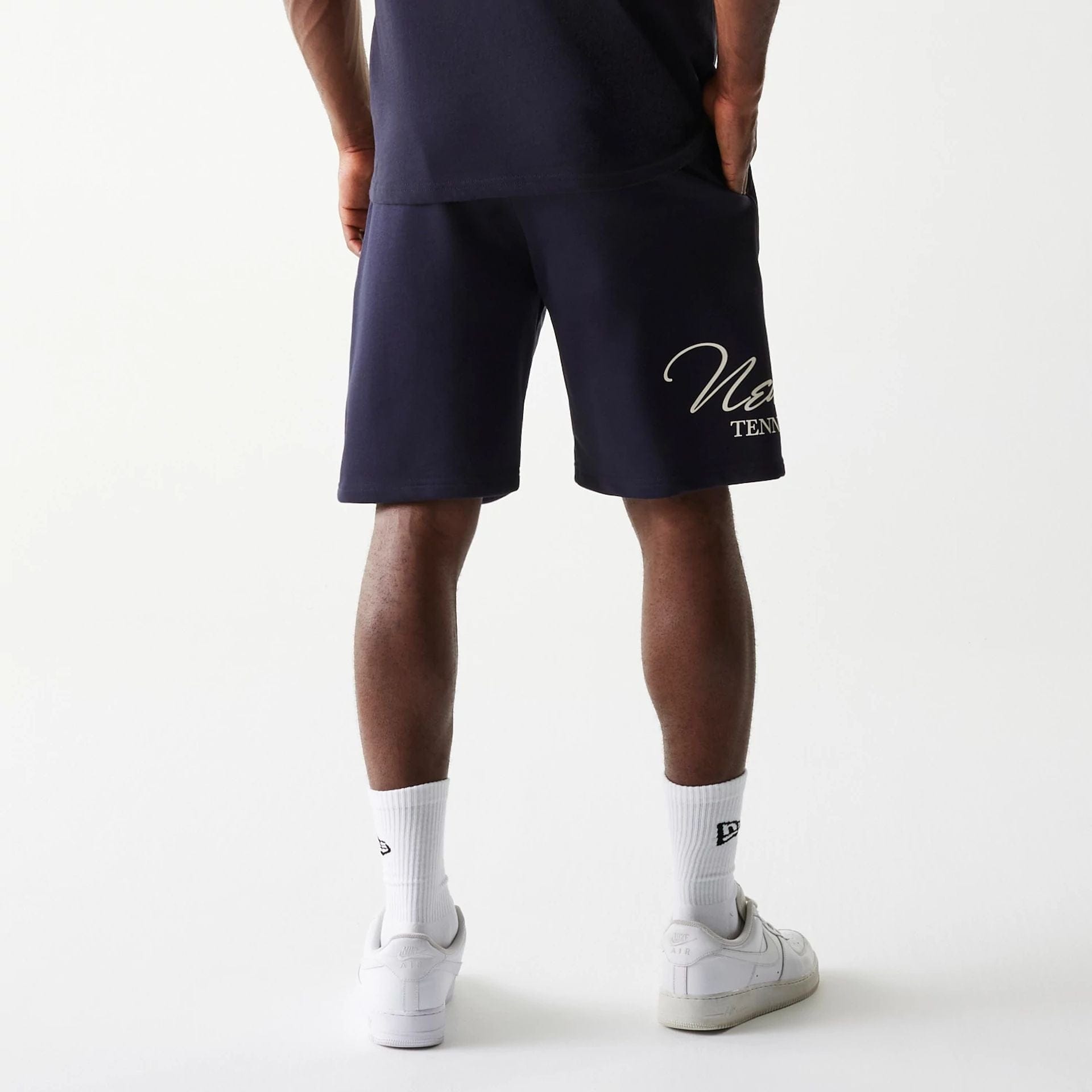 The Male model is wearing New Era Side Logo Navy Shorts 2