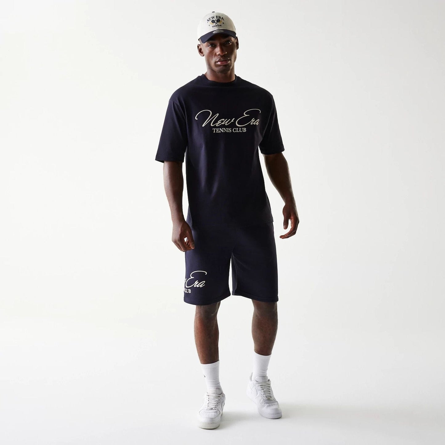 The Male model is wearing New Era Side Logo Navy Shorts 8