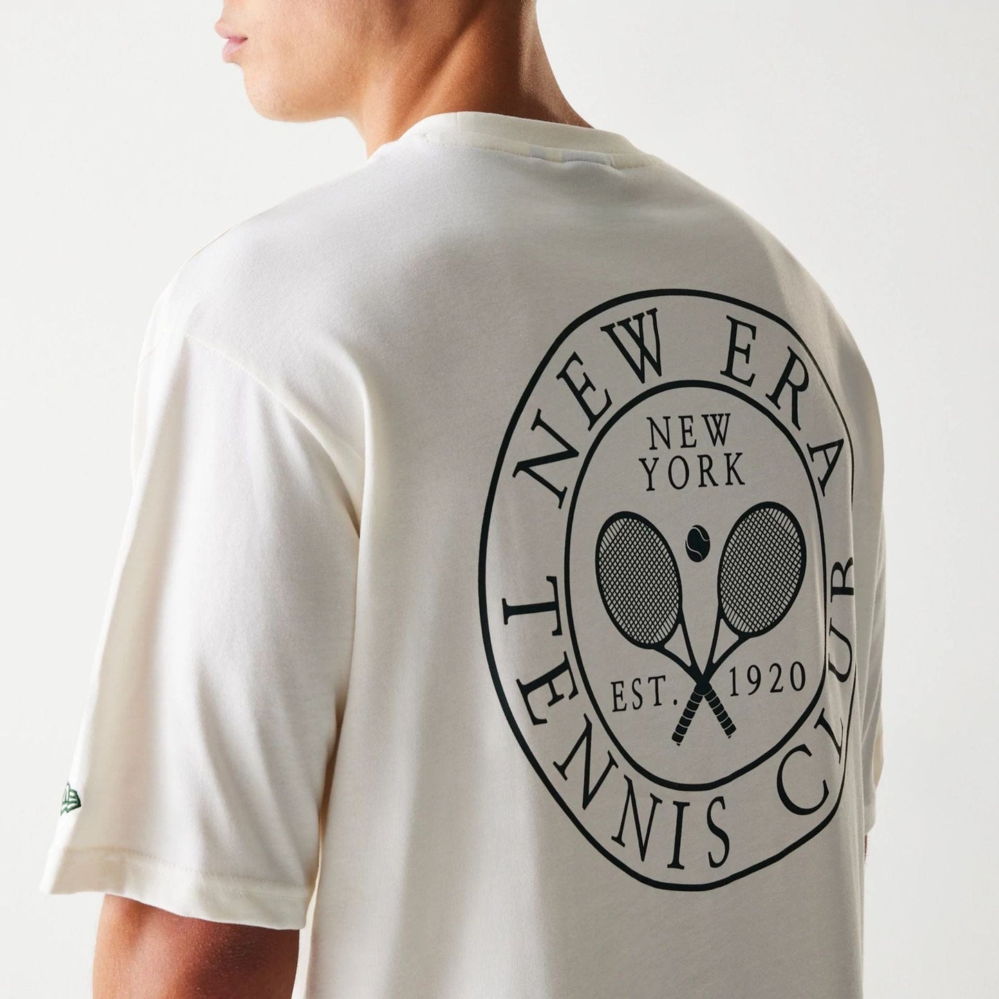 The Male model is wearing New Era Open White Oversized T-Shirt 4