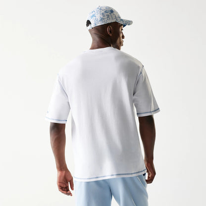 The Male model is wearing New Era Orthodox Vase White Oversized T-Shirt 2