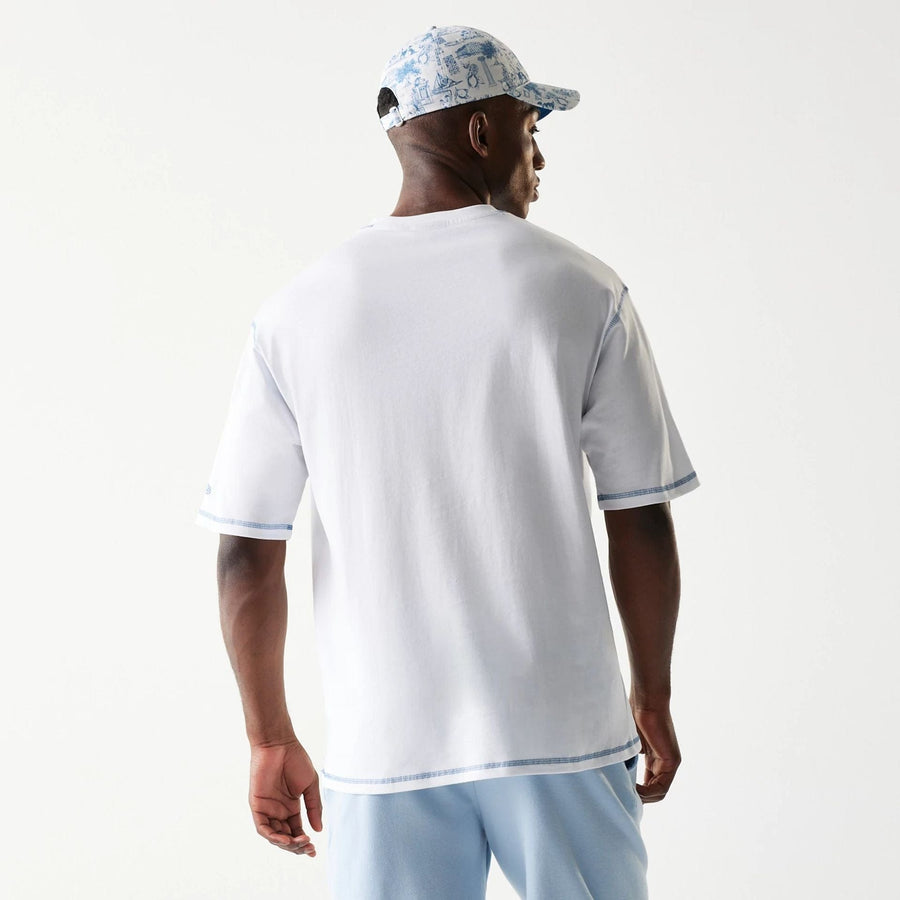 The Male model is wearing New Era Orthodox Vase White Oversized T-Shirt 2