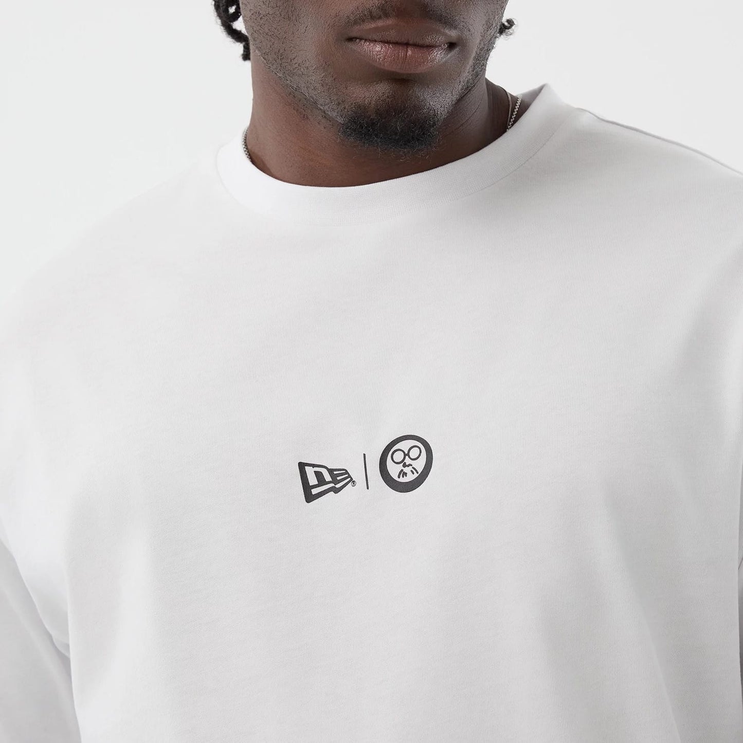 The Male model is wearing Sakamoto Days Icon Netflix White T-Shirt 4