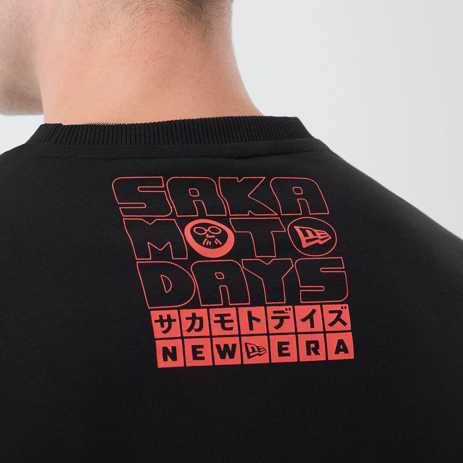 The Male model is wearing Sakamoto Days Netflix Black Crew Neck Sweater 6