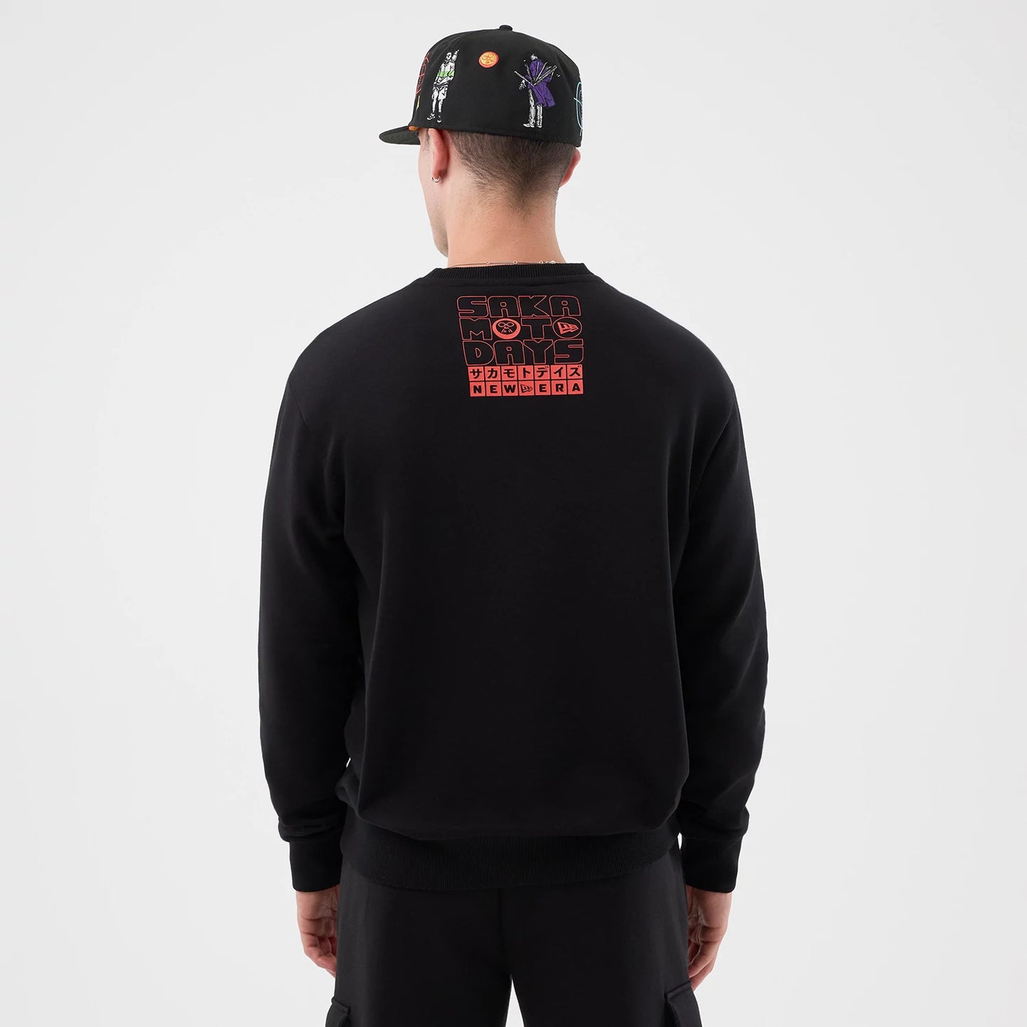 The Male model is wearing Sakamoto Days Netflix Black Crew Neck Sweater 2