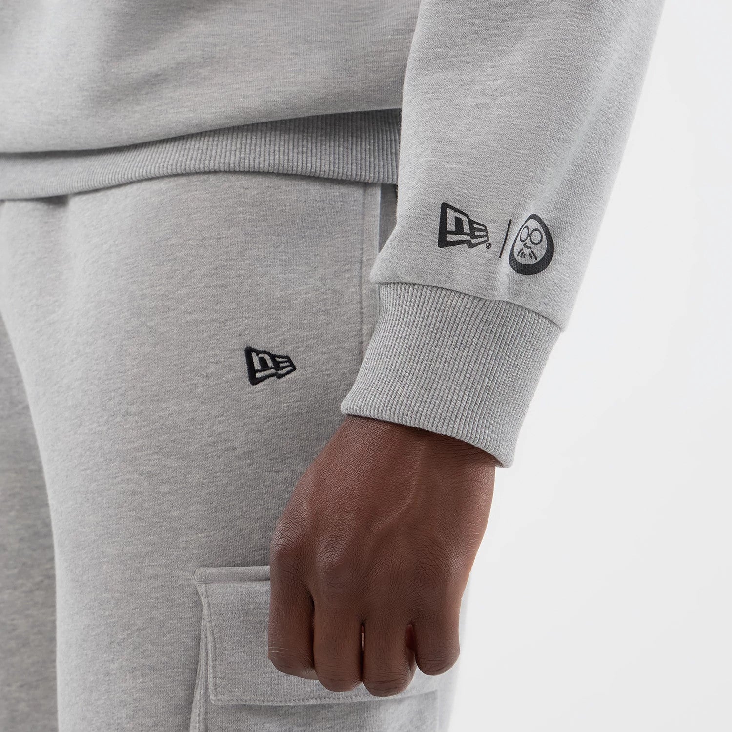 The Male model is wearing Sakamoto Days Netflix Grey Crew Neck Sweater 4