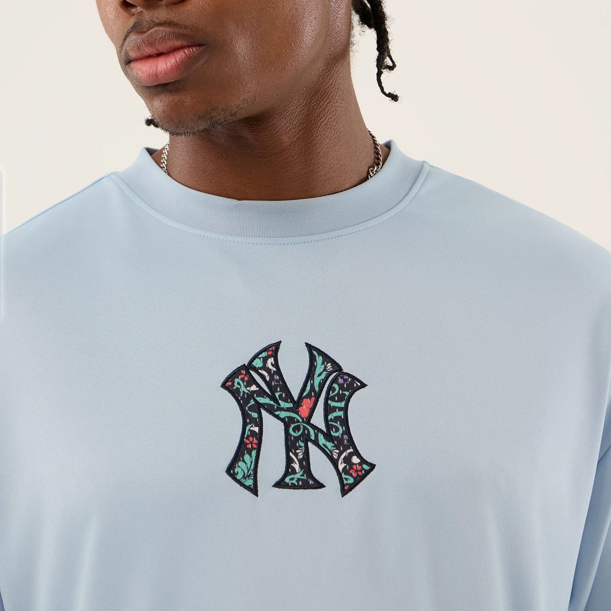 The Male model is wearing New York Yankees MLB Mesh Infill Pastel Blue Oversized T-Shirt 3