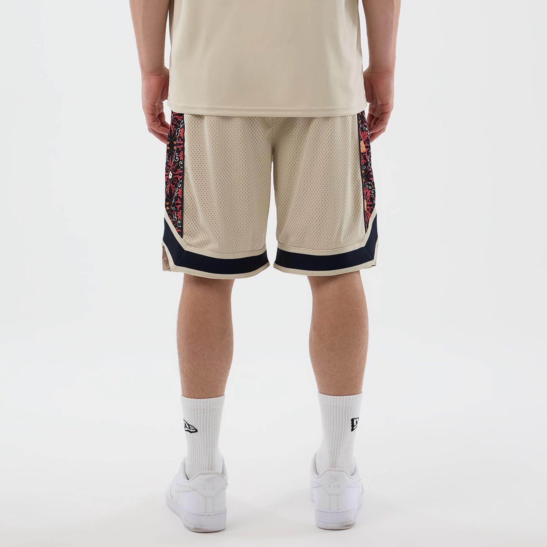 The Male model is wearing New Era Mesh Light Beige Mesh Shorts 2