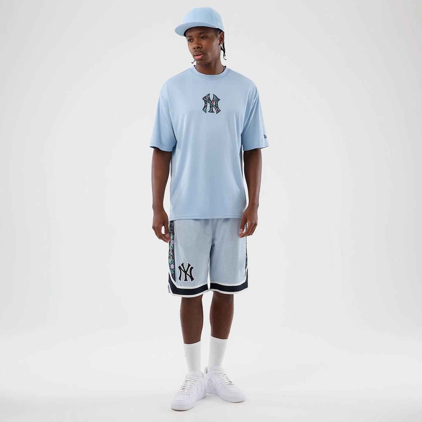 The Male model is wearing New York Yankees MLB Mesh Pastel Blue Mesh Shorts 3