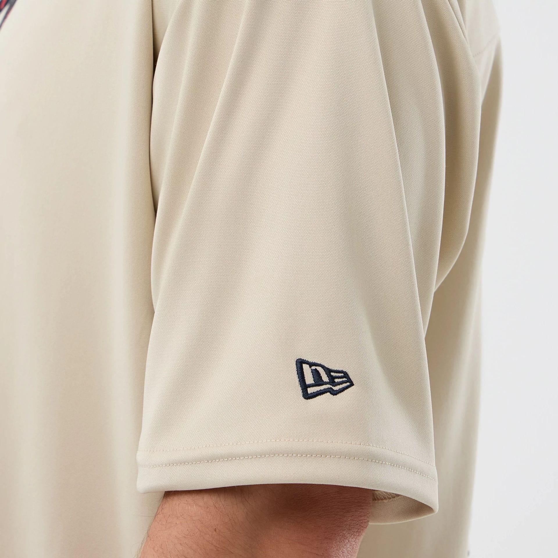 The Male model is wearing New Era Mesh Infill Light Beige Oversized T-Shirt 5