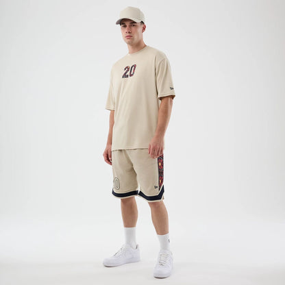 The Male model is wearing New Era Mesh Infill Light Beige Oversized T-Shirt 8