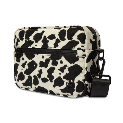 Pictured is this New Era Cow Jacquard Waist Bag in light beige. 1