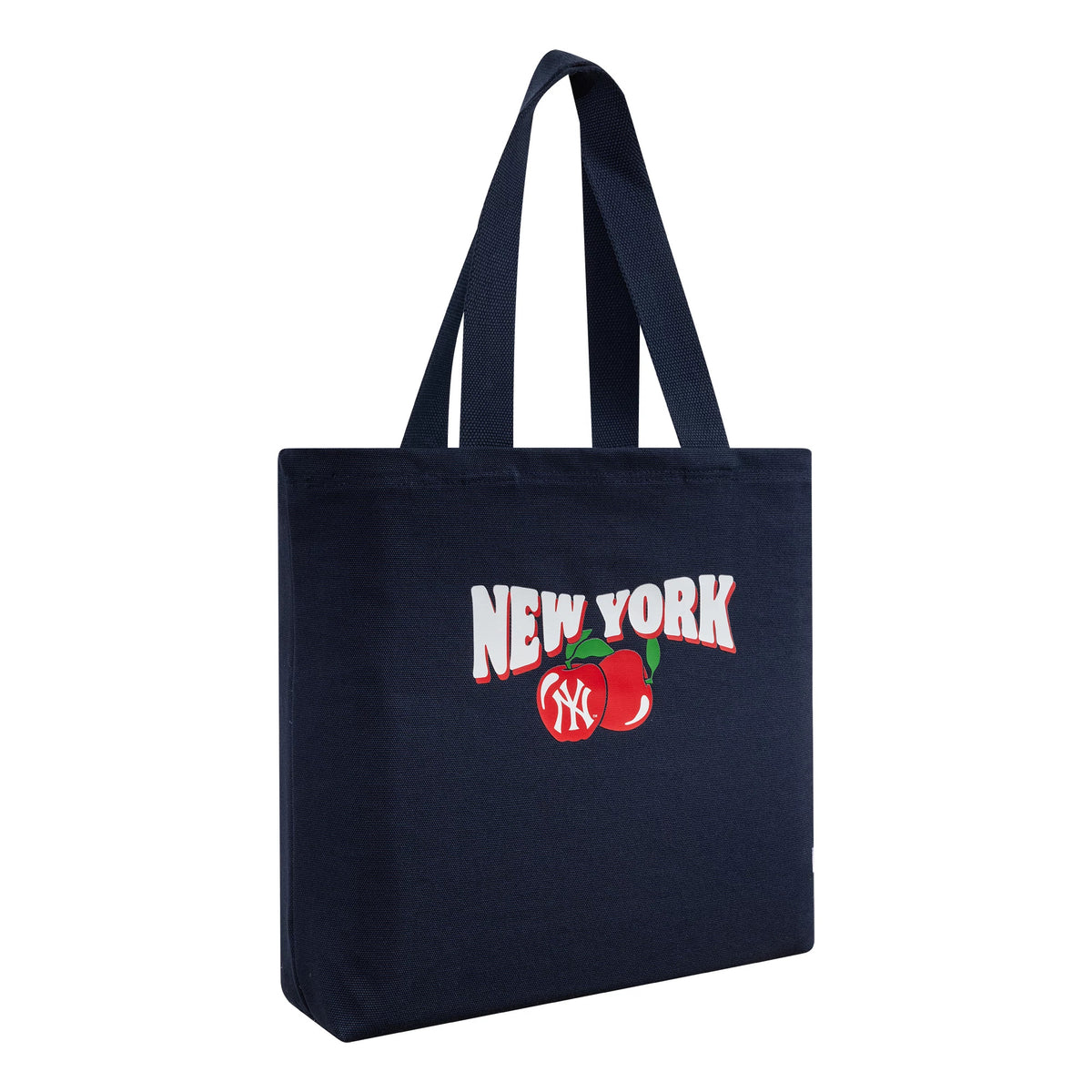 New Era New York Yankees MLB Fruit Navy Tote Bag, three-quarter view displaying the New York text and fruit graphic on the side, with the Yankees logo inside the fruit and two handles extending from the top.
