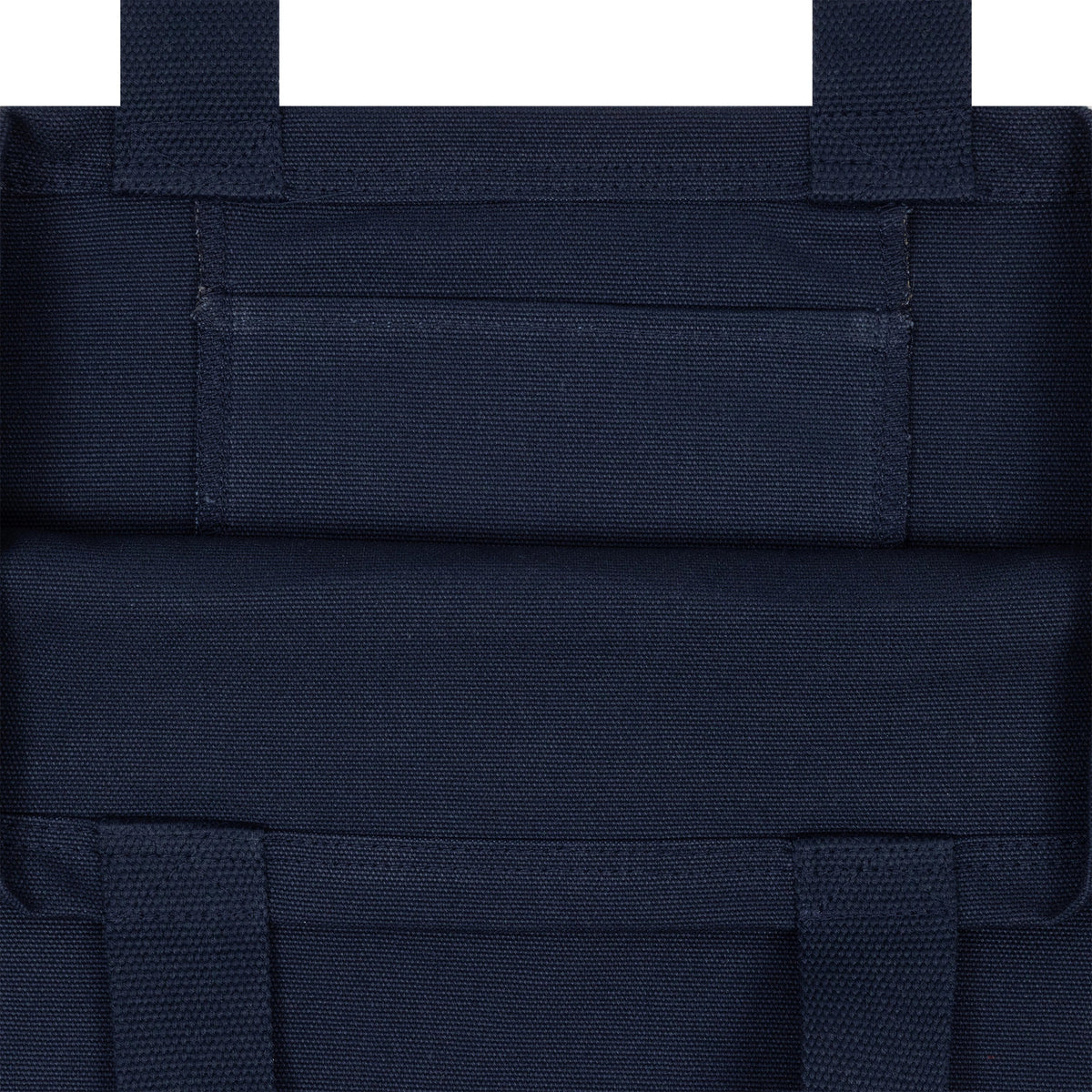 New Era New York Yankees MLB Fruit Navy Tote Bag, close-up view showing the navy fabric with stitching and detailed construction at the top section, featuring reinforced straps and a rectangular band across the upper part.