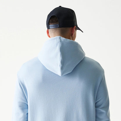 The model is wearing this MLB League Essential Midi New York Yankees Oversized Pullover Hoodie in pastel blue. 7