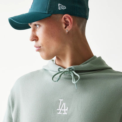 The model is wearing this MLB League Essential Midi LA Dodgers Oversized Pullover Hoodie in pastel green. 3