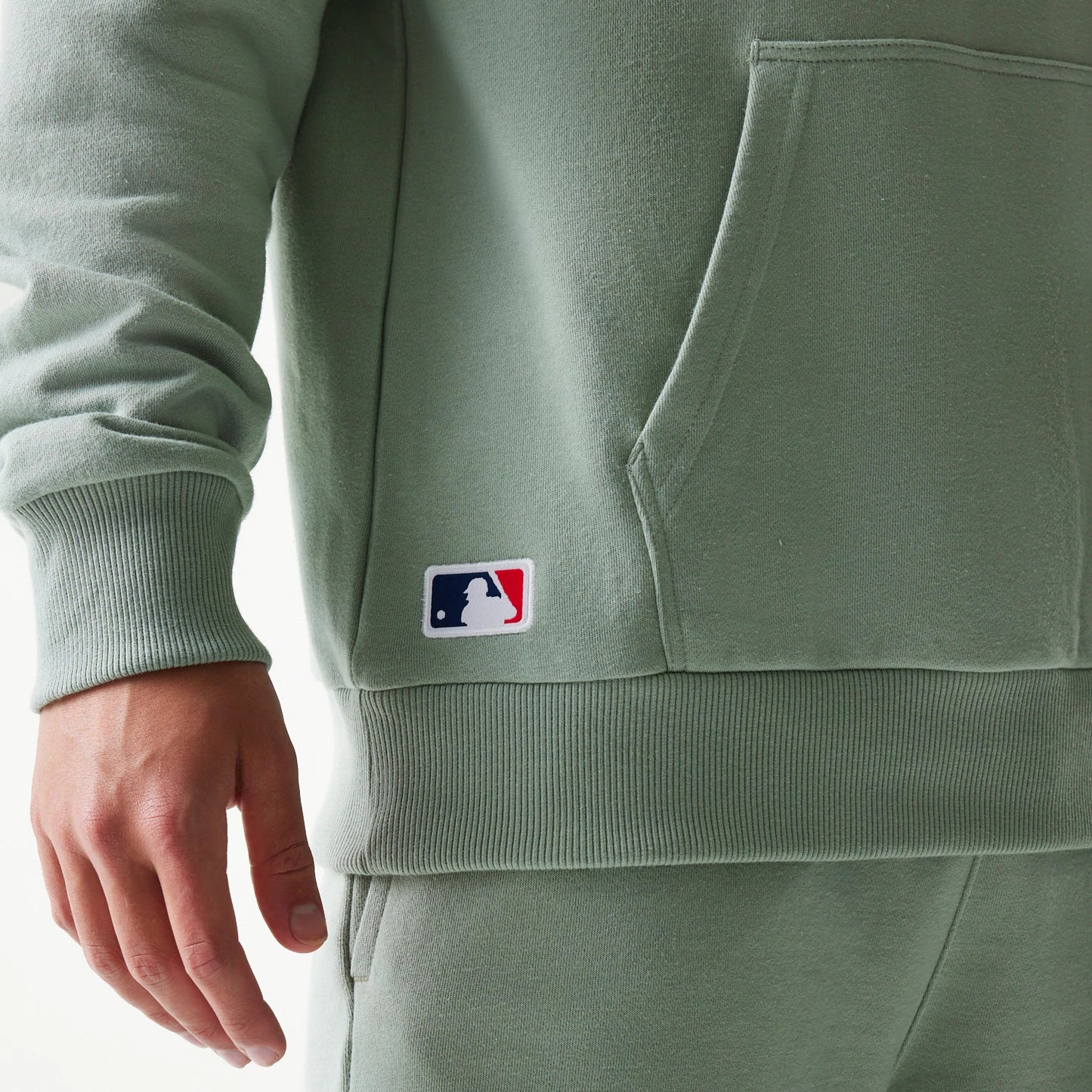 The model is wearing this MLB League Essential Midi LA Dodgers Oversized Pullover Hoodie in pastel green. 4