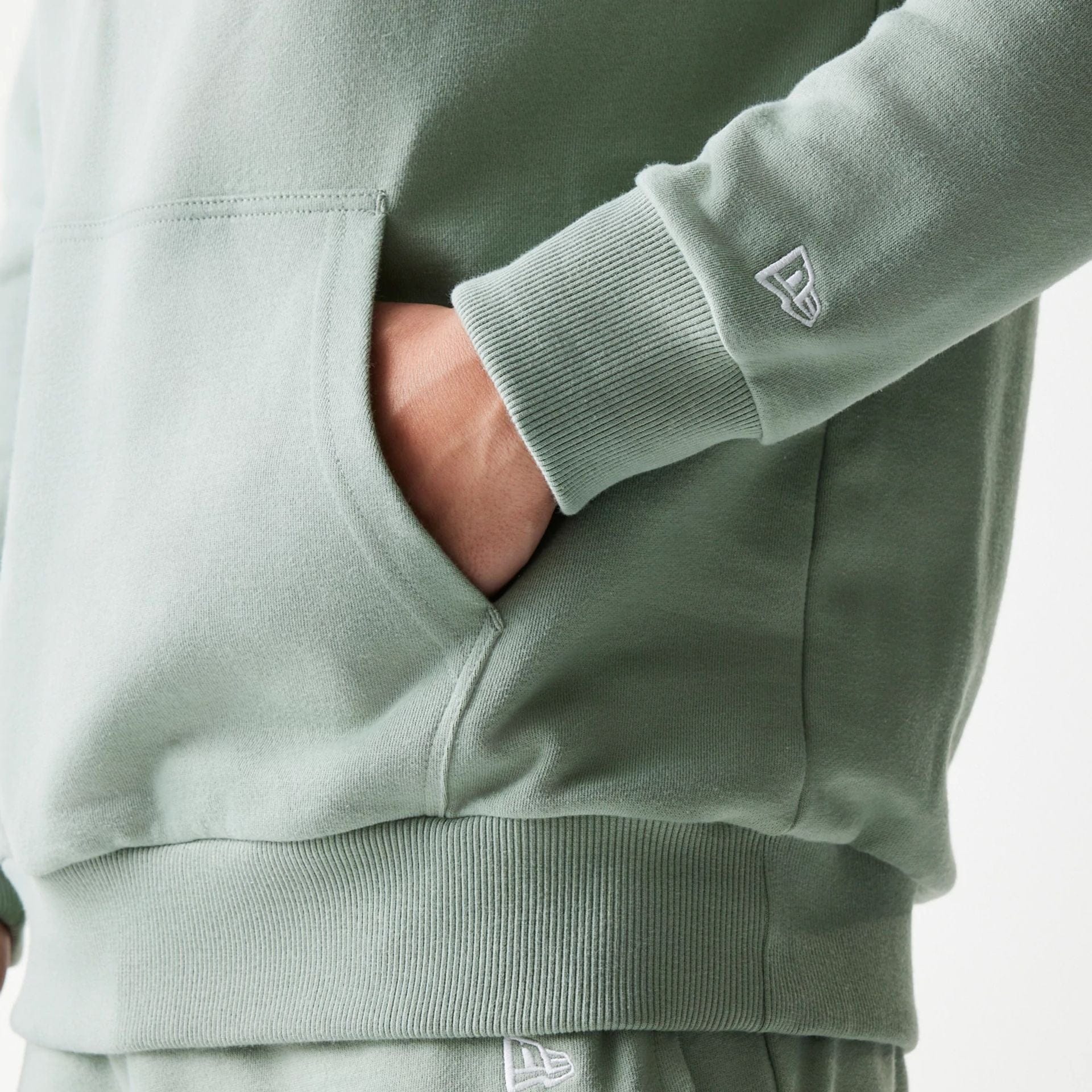 The model is wearing this MLB League Essential Midi LA Dodgers Oversized Pullover Hoodie in pastel green. 5