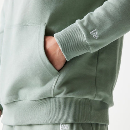 The model is wearing this MLB League Essential Midi LA Dodgers Oversized Pullover Hoodie in pastel green. 5