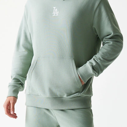 The model is wearing this MLB League Essential Midi LA Dodgers Oversized Pullover Hoodie in pastel green. 6