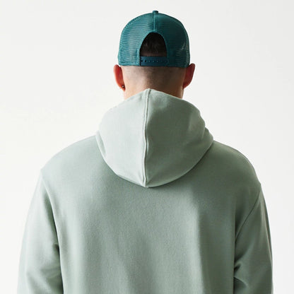 The model is wearing this MLB League Essential Midi LA Dodgers Oversized Pullover Hoodie in pastel green. 7