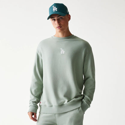 The model is wearing this MLB League Essential Midi LA Dodgers Oversized Crew Neck Sweater in pastel green. 3
