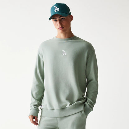The model is wearing this MLB League Essential Midi LA Dodgers Oversized Crew Neck Sweater in pastel green. 3