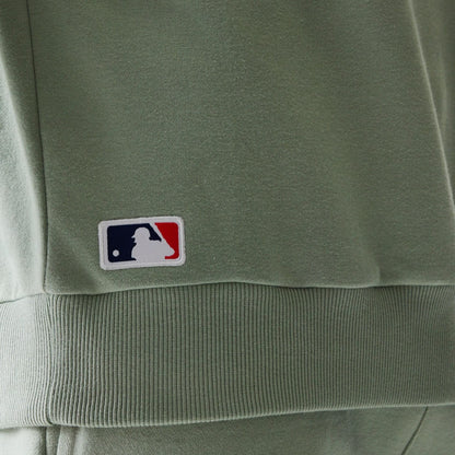 The model is wearing this MLB League Essential Midi LA Dodgers Oversized Crew Neck Sweater in pastel green. 8