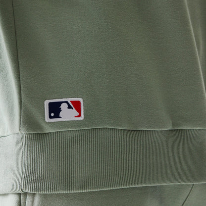 The model is wearing this MLB League Essential Midi LA Dodgers Oversized Crew Neck Sweater in pastel green. 8