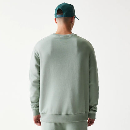 The model is wearing this MLB League Essential Midi LA Dodgers Oversized Crew Neck Sweater in pastel green. 2