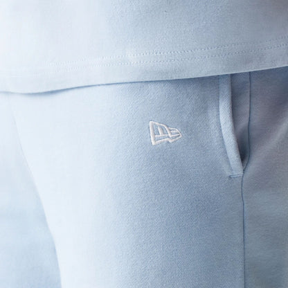 The model is wearing this MLB League Essential Midi New York Yankees Shorts in pastel blue. 5