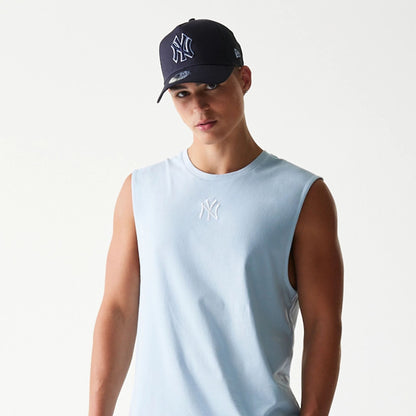 The model is wearing this MLB League Essential New York Yankees Sleeveless T-Shirt in pastel blue. 6