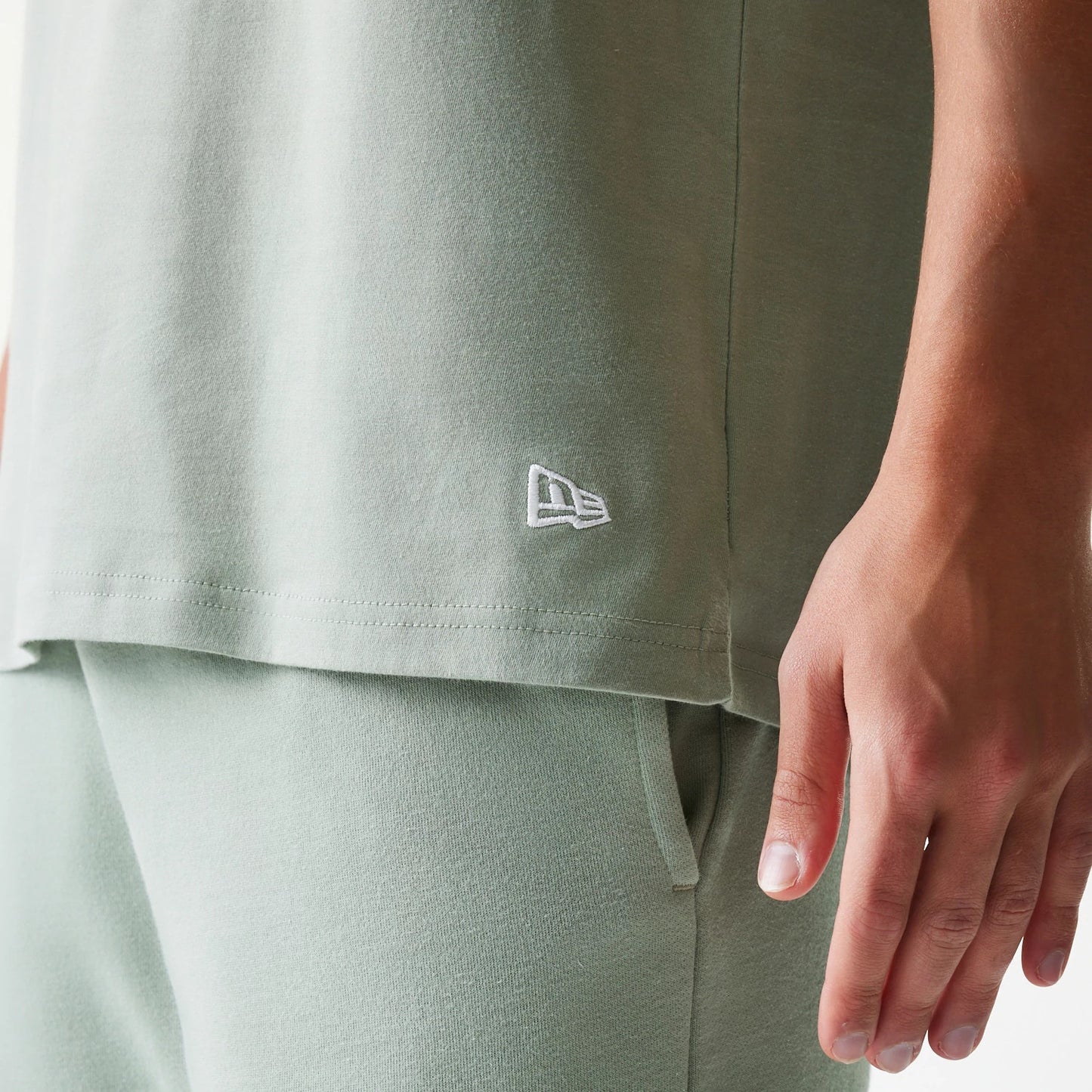 The model is wearing this MLB League Essential LA Dodgers Sleeveless T-Shirt in pastel green. 6