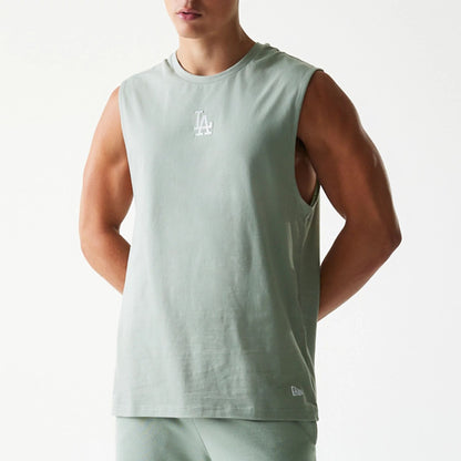 The model is wearing this MLB League Essential LA Dodgers Sleeveless T-Shirt in pastel green. 7