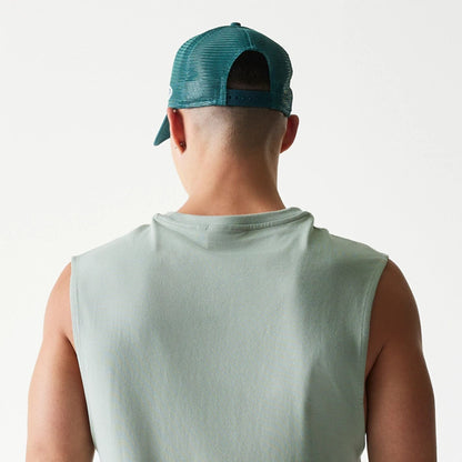 The model is wearing this MLB League Essential LA Dodgers Sleeveless T-Shirt in pastel green. 8