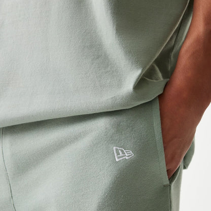 The model is wearing this MLB League Essential Midi LA Dodgers Shorts in pastel green. 5