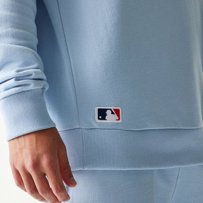 The model is wearing this MLB League Essential Midi New York Yankees Oversized Crew Neck Sweater in pastel blue. 4