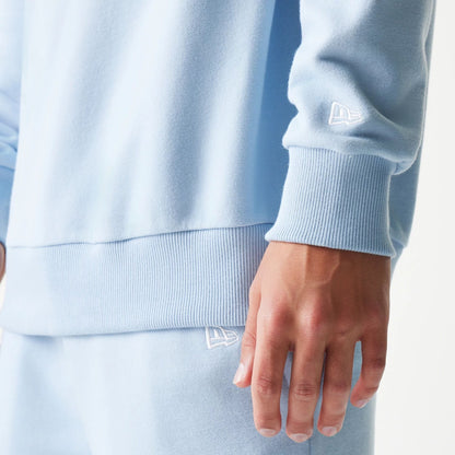 The model is wearing this MLB League Essential Midi New York Yankees Oversized Crew Neck Sweater in pastel blue. 5