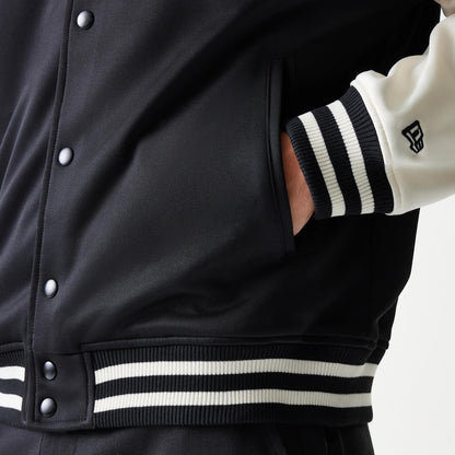 The model is wearing this NBA Chicago Bulls Bomber Jacket in black. 7
