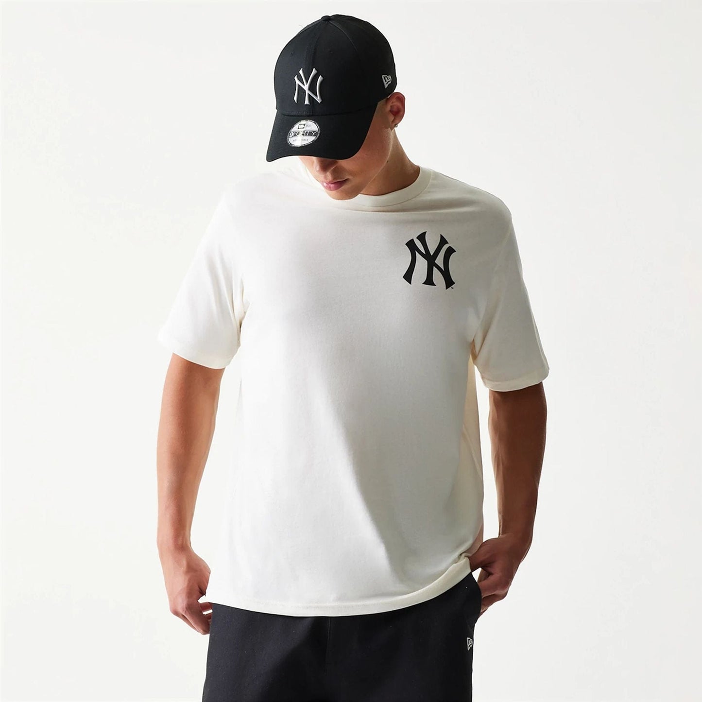 The model is wearing this MLB Food Graphic New York Yankees T-Shirt in open white. 3
