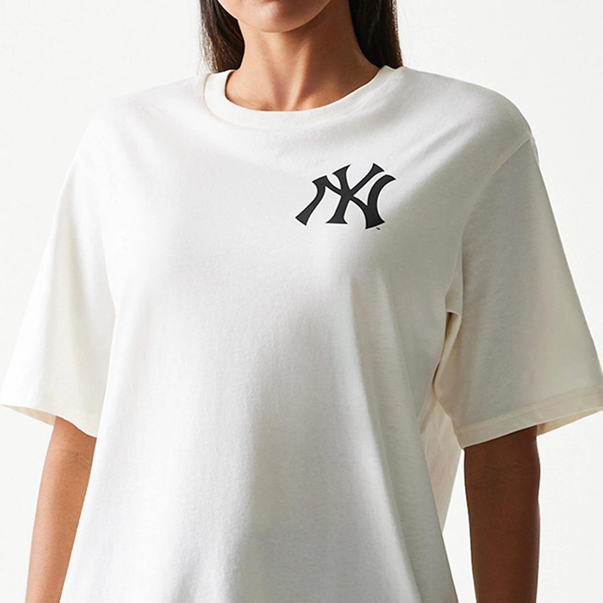New Era New York Yankees MLB Food Graphic Open White T-Shirt, front view showing the black embroidered NY logo on the left chest of the plain white short-sleeve design, worn casually on a model.