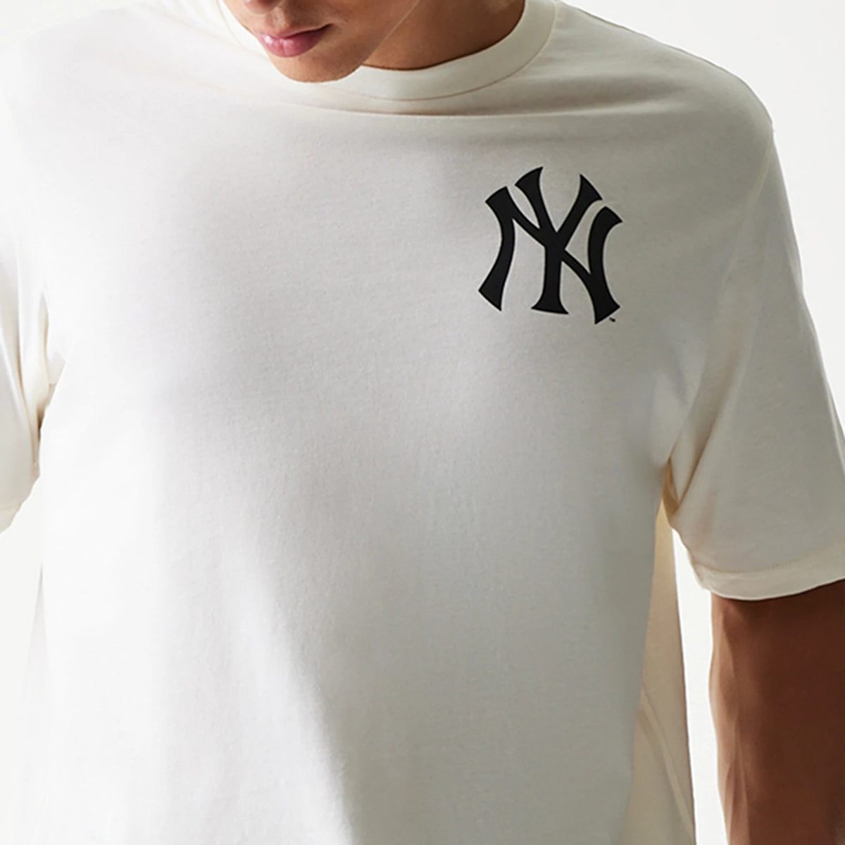 New Era New York Yankees MLB Food Graphic Open White T-Shirt, front view on-model showcasing a black printed Yankees logo on the left chest, with short sleeves and a crew neckline.