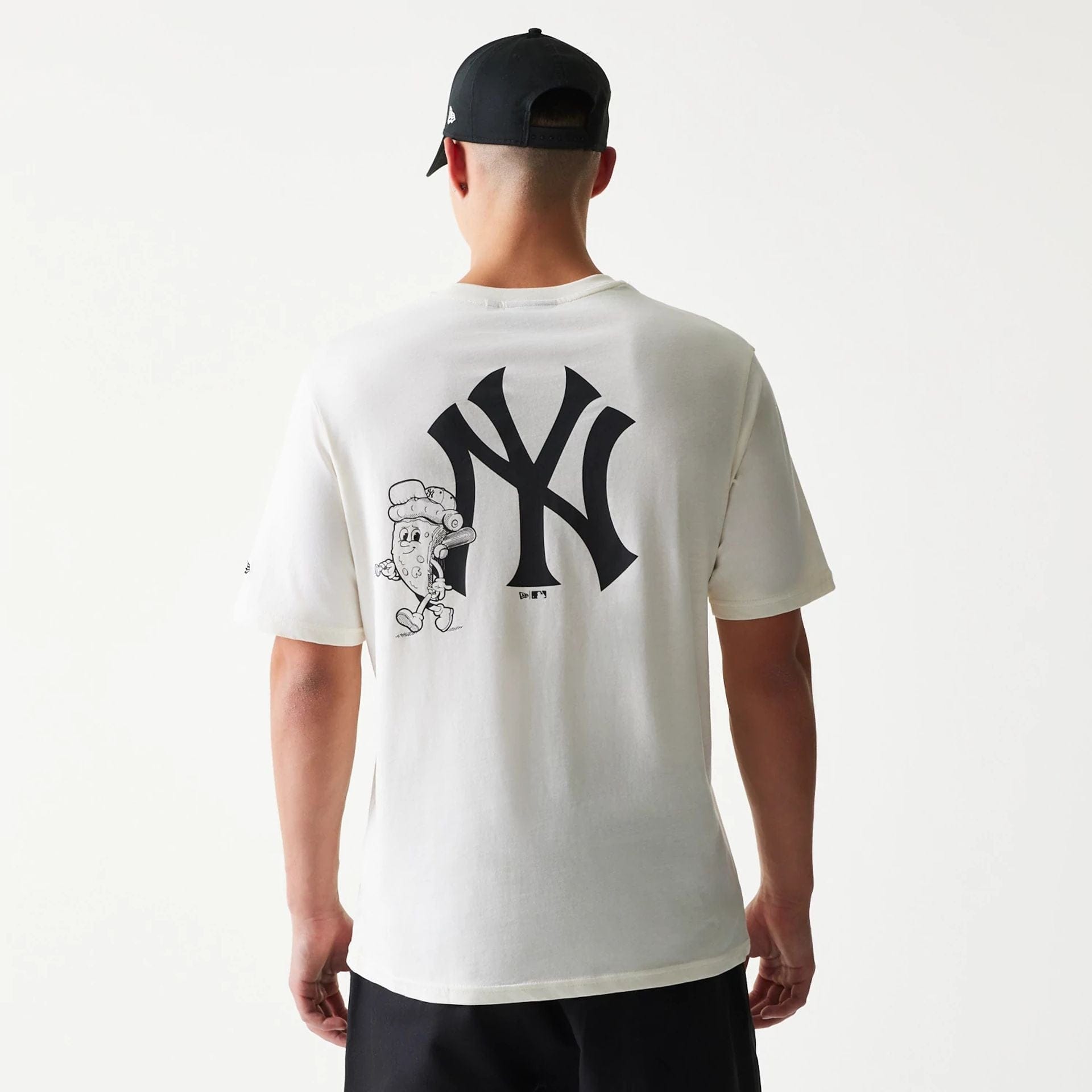 The model is wearing this MLB Food Graphic New York Yankees T-Shirt in open white. 2