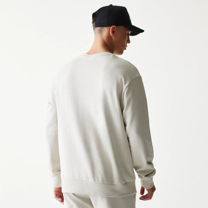 The model is wearing this NBA League Essential LA Lakers Oversized Crew Neck Sweater in cream. 2