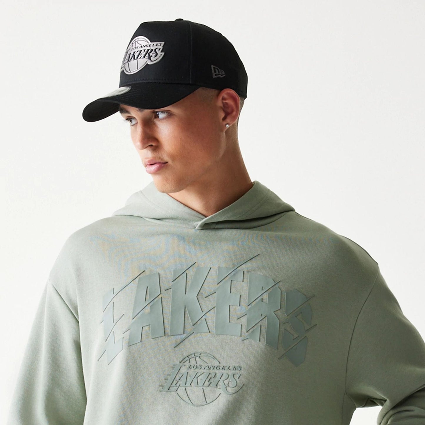 The model is wearing this NBA LA Lakers Oversized Pullover Hoodie in pastel green. 6